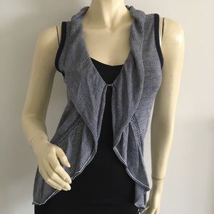 Navy and white striped knit vest with ruffle trim